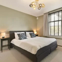 Straluma Art Deco plafondlamp goud met smoke en amber glas><noscript><img width=